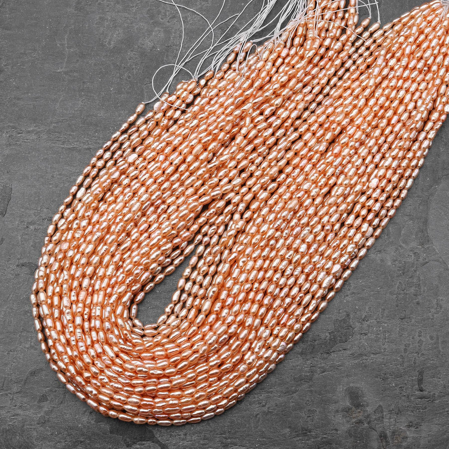 AAA Small Genuine Freshwater Natural Metallic Peach Apricot Pearl Oval Rice Shape Iridescent High Luster Pearl 15.5" Strand
