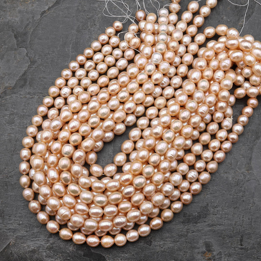 AAA Genuine Natural Freshwater Golden Peach Apricot Potato Oval Pearl Iridescent Luster 15.5" Strand