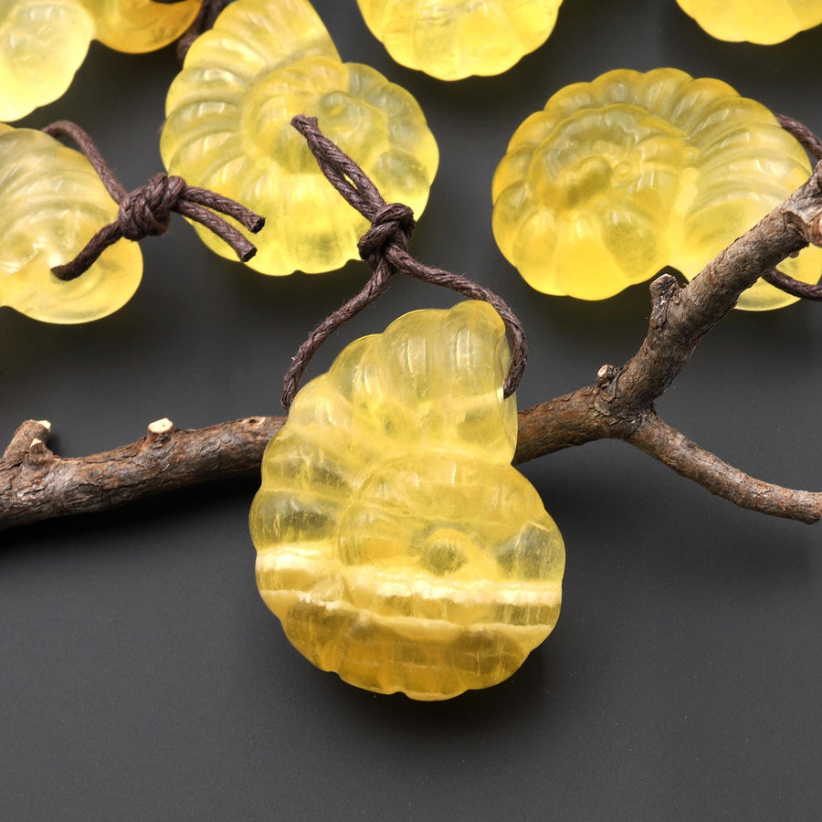 AAA Hand Carved Natural Candy Fluorite Yellow Ammonite Pendant