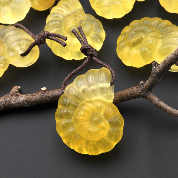 AAA Hand Carved Natural Candy Fluorite Yellow Ammonite Pendant