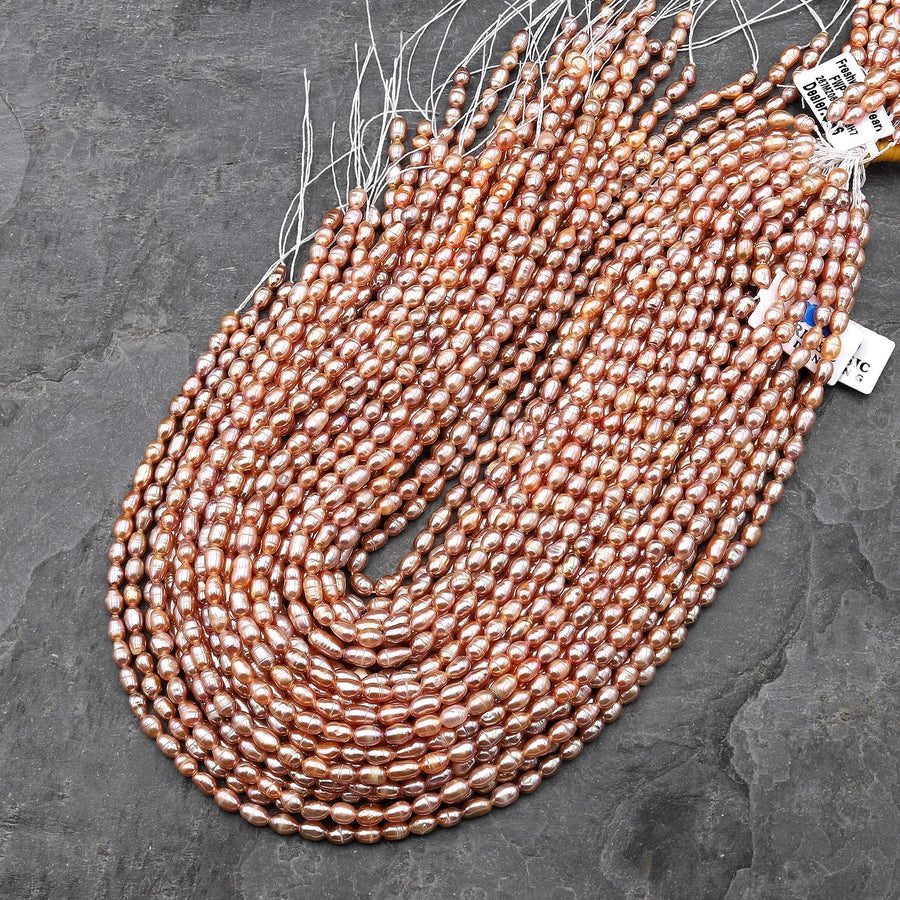 Genuine Freshwater Natural Metallic Mauve Pink Golden Peach Pearl Oval Rice Shape Iridescent High Luster Pearl 14" Strand