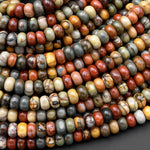 May include: A close-up of a pile of colorful, round, polished stones. The stones are a mix of red, orange, yellow, brown, and gray. The stones are smooth and have a natural, organic look. The stones are arranged in a random pattern, creating a visually appealing and textured surface.