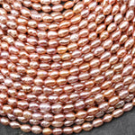 Genuine Freshwater Natural Metallic Mauve Pink Golden Peach Pearl Oval Rice Shape Iridescent High Luster Pearl 14" Strand