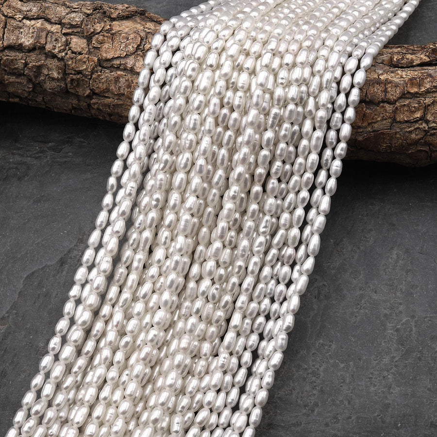 AAA Genuine Freshwater White Oval Rice Smooth Pearls 15.5" Strand