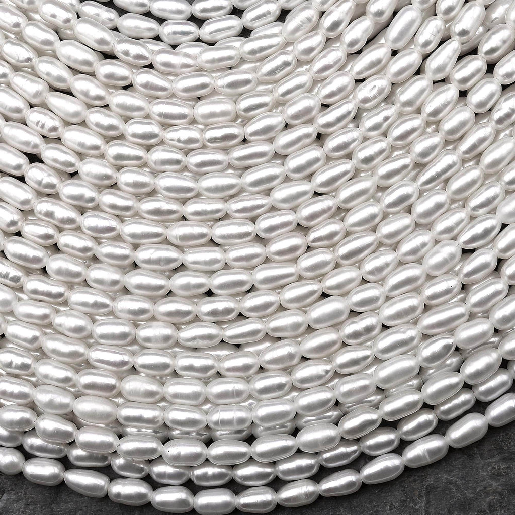 AAA Genuine Freshwater White Oval Rice Smooth Pearls 15.5" Strand