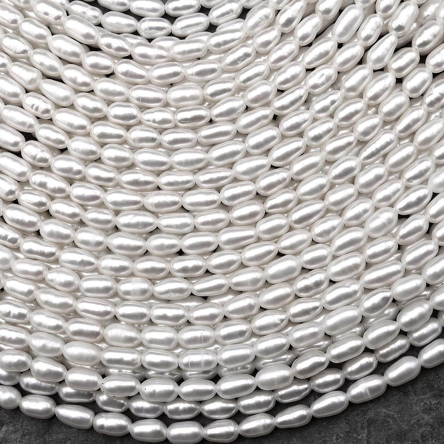 AAA Genuine Freshwater White Oval Rice Smooth Pearls 15.5" Strand