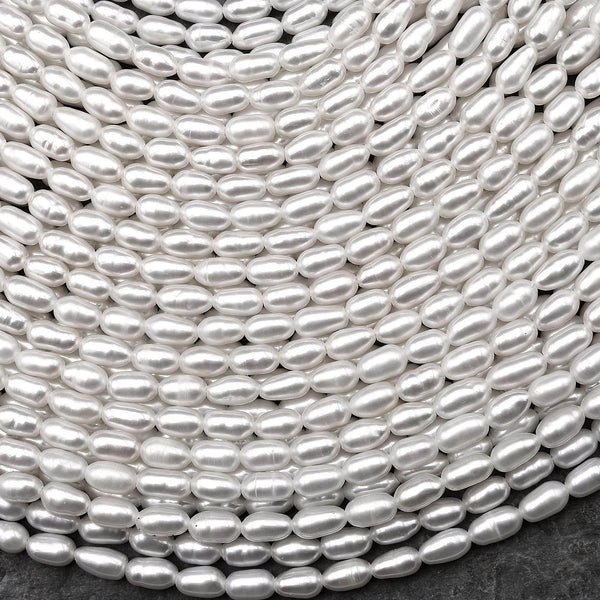AAA Genuine Freshwater White Oval Rice Smooth Pearls 15.5" Strand