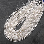 AAA Genuine Freshwater White Oval Rice Smooth Pearls 15.5" Strand