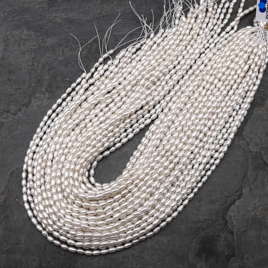 AAA Genuine Freshwater White Oval Rice Smooth Pearls 15.5" Strand