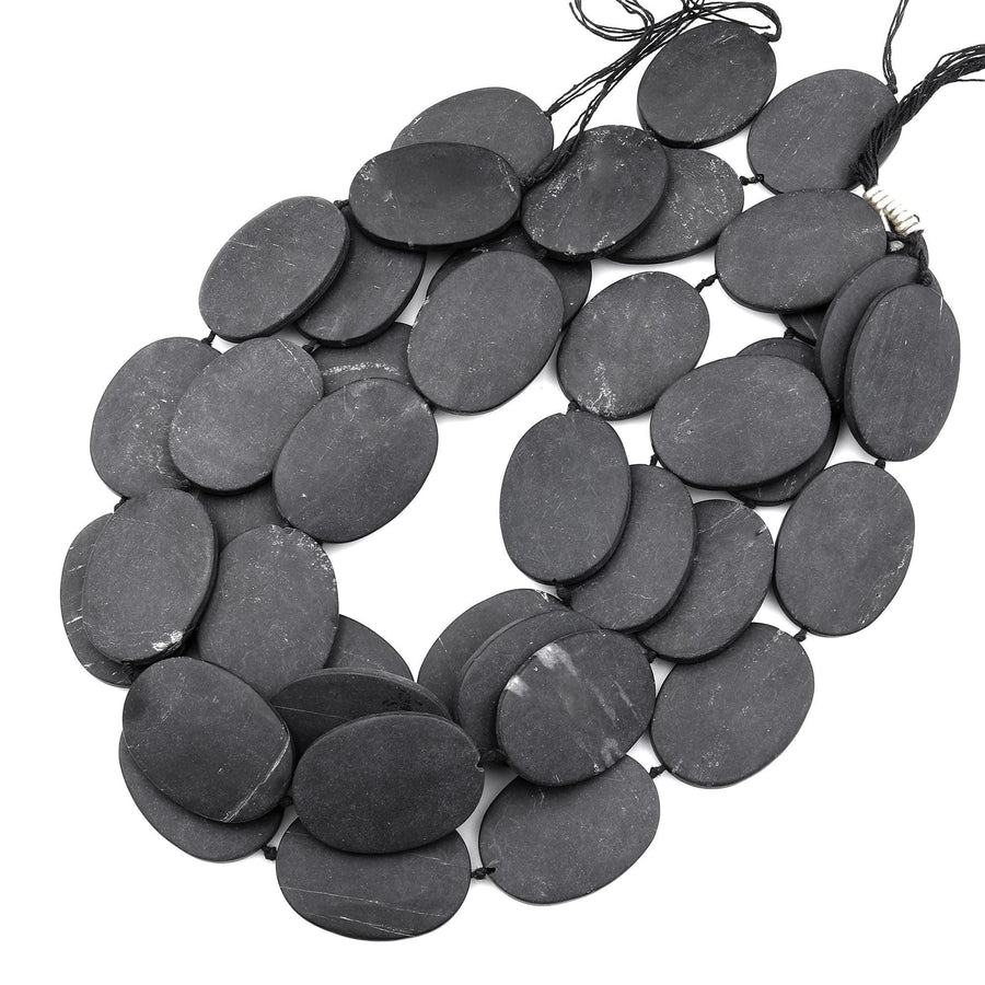 Large Hand Cut Matte Natural Brazilian Black Stone Oval Beads Gemstone 15.5" Strand