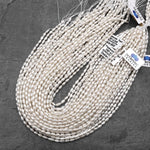 Iridescent AAA Genuine Freshwater Small Long Rice Seed Pearls White Oval Pearl 4x6mm 14" Strand