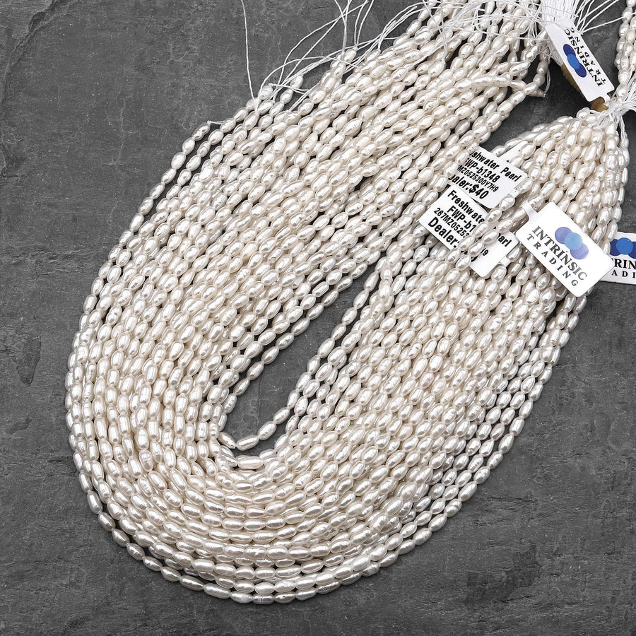 Iridescent AAA Genuine Freshwater Small Long Rice Seed Pearls White Oval Pearl 4x6mm 14" Strand