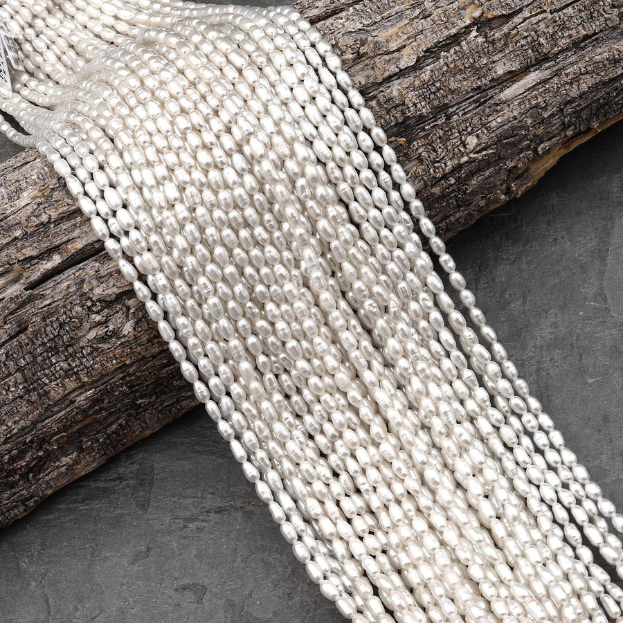 Iridescent AAA Genuine Freshwater Small Long Rice Seed Pearls White Oval Pearl 4x6mm 14" Strand