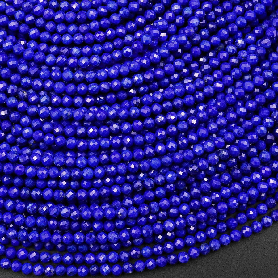 May include: Close-up view of numerous faceted lapis lazuli beads.  The beads are a deep, rich blue color and are uniformly sized and shaped.  They are arranged in parallel rows, creating a dense, textured pattern. The image showcases the vibrant color and faceted surfaces of the gemstone beads, ideal for jewelry making or crafting projects.  These faceted beads are perfect for creating necklaces, bracelets, earrings, and other jewelry items.