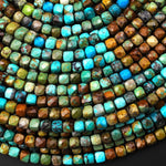 May include: A close-up of a strand of turquoise gemstone beads. The beads are faceted and have a mix of blue, green, and brown tones.