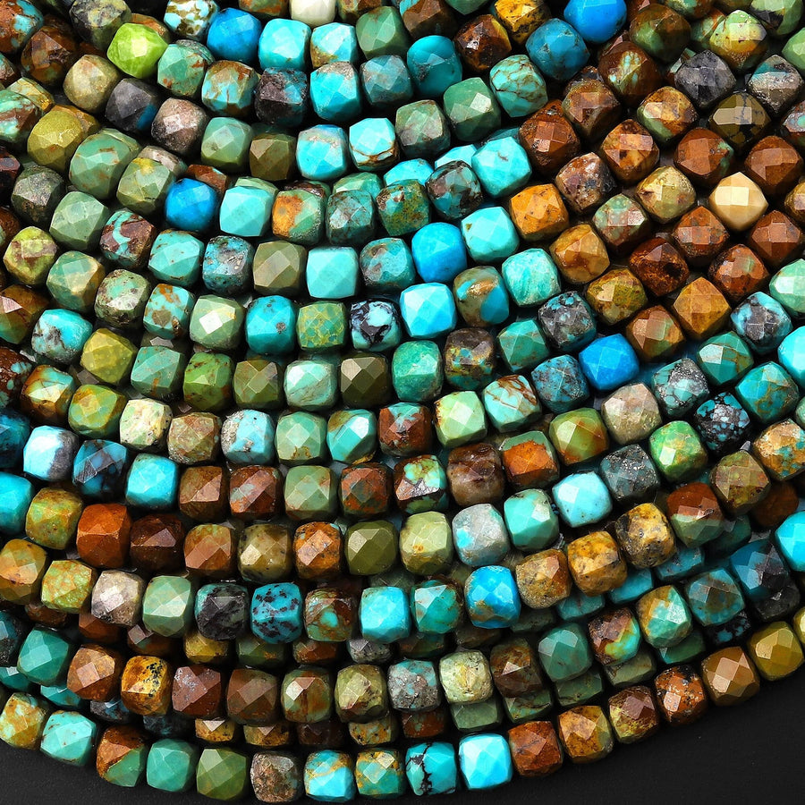 May include: A close-up of a strand of turquoise gemstone beads. The beads are faceted and have a mix of blue, green, and brown tones.