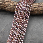 AAA Genuine Natural Metallic Mauve Pink Purple Oval Rice Freshwater Pearl Iridescent High Luster 3x5mm 14.5" Strand