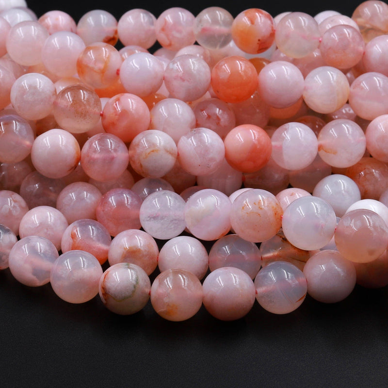 Bead, desert pink marble (natural), 7-8mm round, B grade, Mohs hardness 3.  Sold per 15-1/2 to 16 strand. - Fire Mountain Gems and Beads