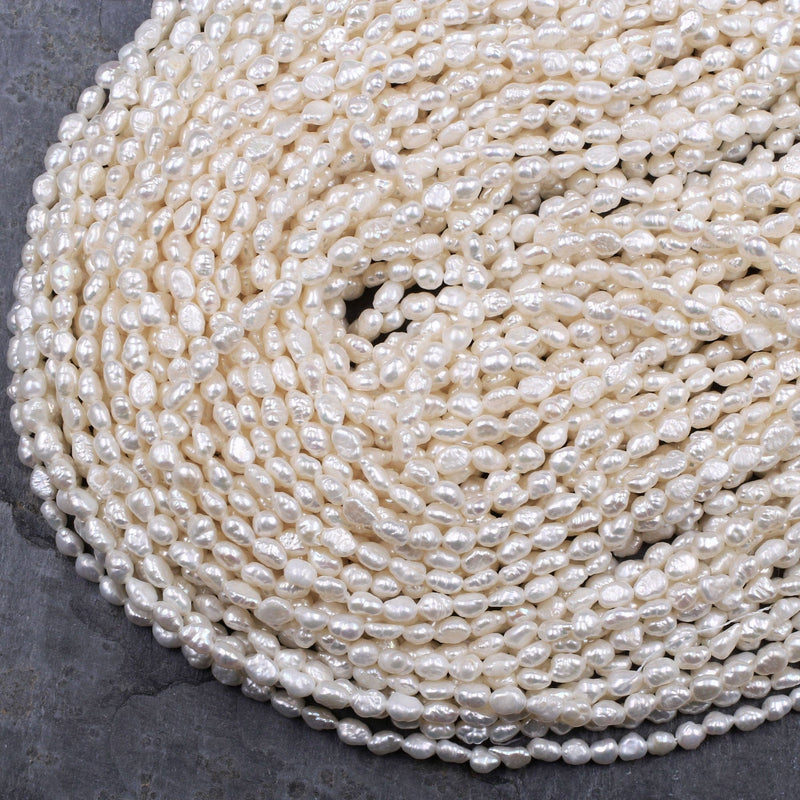 11-13mm Large Oval Shaped AA Quality White Rice Pearls Strands