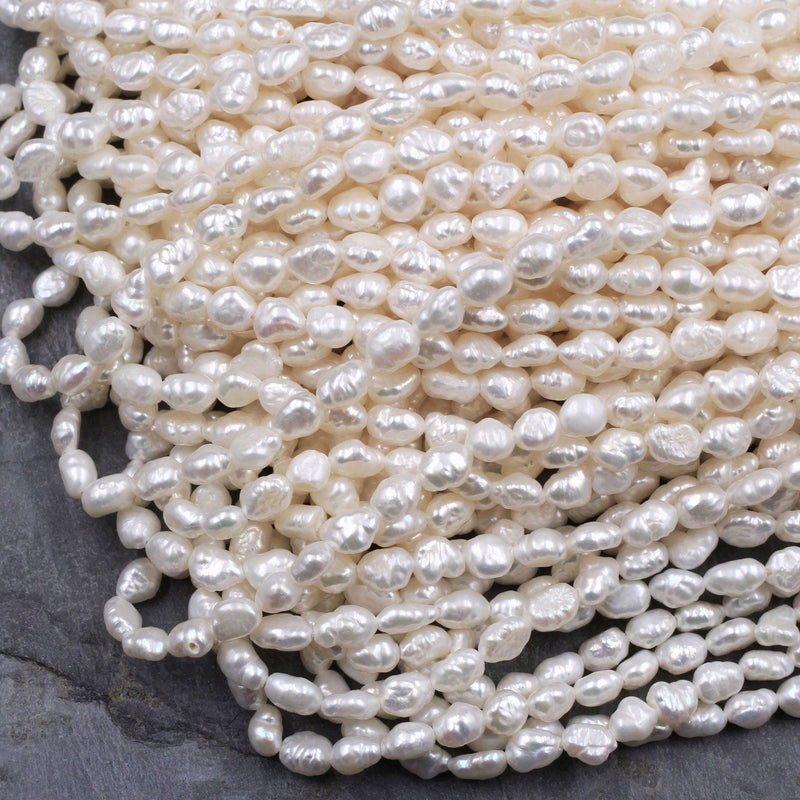 11-13mm Large Oval Shaped AA Quality White Rice Pearls Strands