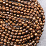 Faceted Golden Bronze Copper Oval Rice Pearls 6mm Shimmery Iridescent Genuine Freshwater Pearl 16" Strand