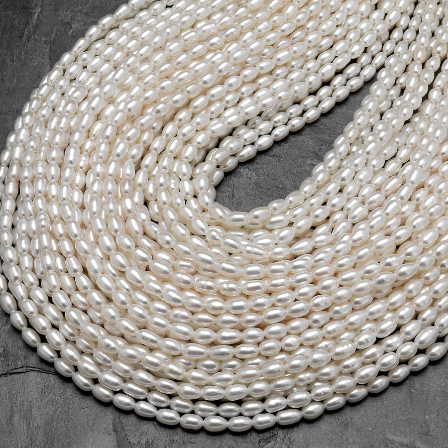 AAA Genuine Freshwater White Pearl Oval Rice Shape 5x3mm Iridescent High Luster 15.5" Strand